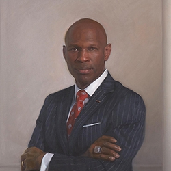 commissioned portrait of a man standing, arms crossed, in a striped suit and tie. 