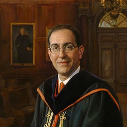 commissioned portrait of man in academic robes, holding his cap and tassel. 