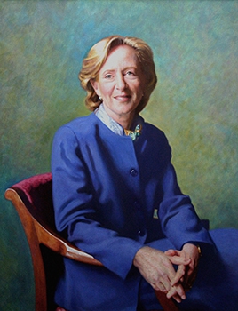 commissioned portrait of a woman sitting down in a blue pants suit, fingers intertwined. 