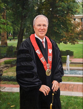 commissioned portrait of an older gentleman in black academic regalia.