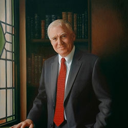 commissioned portrait of a man in dark suit and red tie, hand resting on a stack of books.