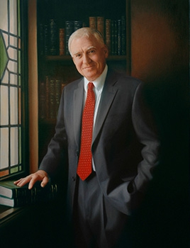 commissioned portrait of a man in dark suit and red tie, hand resting on a stack of books.